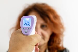 Measure body temperature with electronic device.